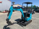 a small blue excavating machine parked in a parking lot