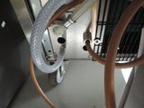 a hose attached to the side of a machine