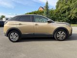 the car is parked in the parking lot in front of the house