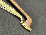 two wooden chopsticks sitting on top of a black table