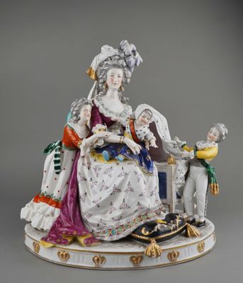 an image of a figurine of a woman and a man sitting on a bench