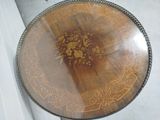 a wooden table with a floral design on it