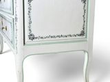 an image of a white chest of drawers on a white background