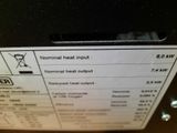 a label on the back of a heater that reads normal heat output
