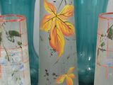 four vases that are sitting next to each other