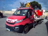a red truck that is parked in a parking lot