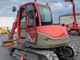 an image of a construction vehicle parked in a parking lot