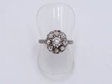 an image of a diamond ring on a clear cup