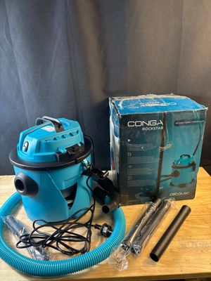 a blue wet dryer sitting on top of a wooden table next to a box