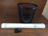 a baseball bat and a trash can on the floor