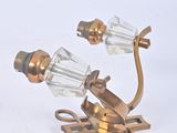 pair of antique brass and glass sconces on a white background