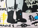 painting of a person standing in front of a wall with graffiti on it