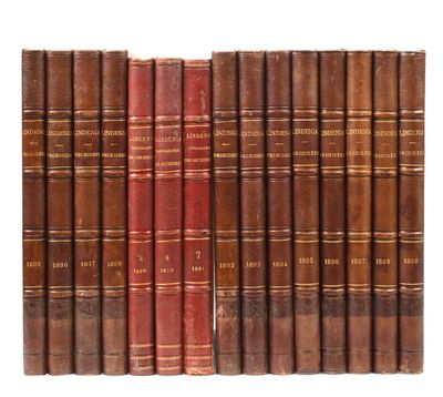 a group of old books sitting on top of each other