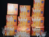a lot of wine glasses that are sitting on a table