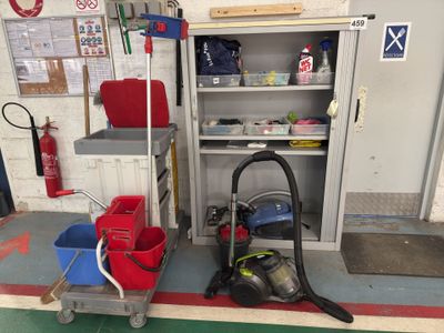 a vacuum cleaner and a bucket on a cart in a garage