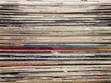 a lot of records stacked on top of each other