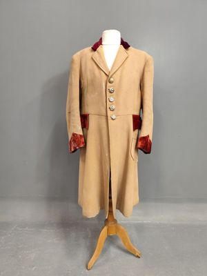 an image of a coat on a mannequin mannequin stand