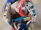 a plastic bag filled with legos on the floor