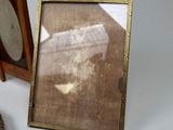 a picture of a teddy bear sitting next to a picture frame