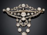 a diamond and gold broochle