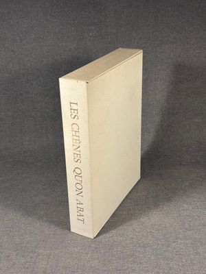 the book is sitting on a table with a gray background