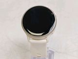 a smart watch that is sitting on top of a stand