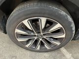 a close up of a tire on a black car