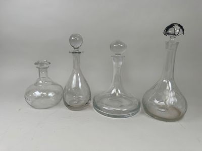 three glass vases sitting next to each other on a table