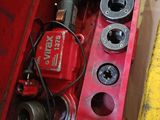 a red tool box with tools in it sitting on the floor