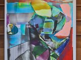 tableau représentant une peinture abstraite colorée sur un mur lambrissé