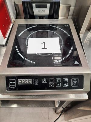 an image of a stove with a sign on top of it