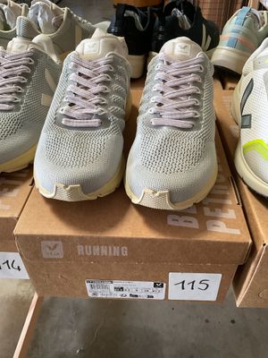 several pairs of running shoes are on display in a store