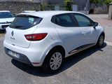 a white car that is parked on the side of the road