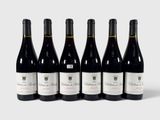 six bouteilles de vin rouge alignées