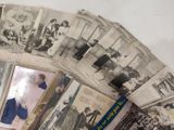 a lot of old photos on the table together