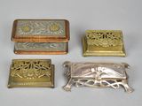 four different types of silver and gold jewelry on a white surface