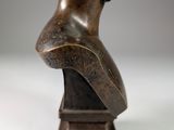statue of a bust of a woman on a wooden base