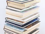 a stack of books sitting on top of each other