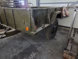 a truck with a trailer attached to it in a garage