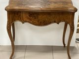 a small wooden table with a drawer underneath it