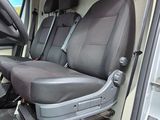 four seats in the back of a van that are empty