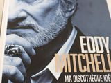 a poster of a man with a ring on a table