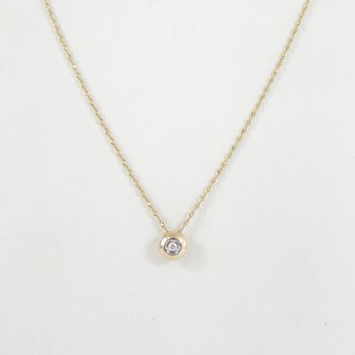 a gold necklace with a single diamond on a gold chain