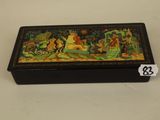 an image of a box with a painting on it on a table