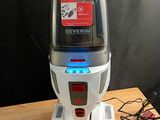 une photo d'un aspirateur posé sur une table