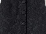 a black skirt with a buttoned front and a floral pattern