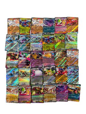 a pile of pokemon cards sitting on top of each other