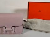 an image of a pink purse and a hat on a table