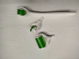 two toothbrushes and a toothpaste on a table