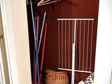 a closet with a lot of clothes hanging on a rack